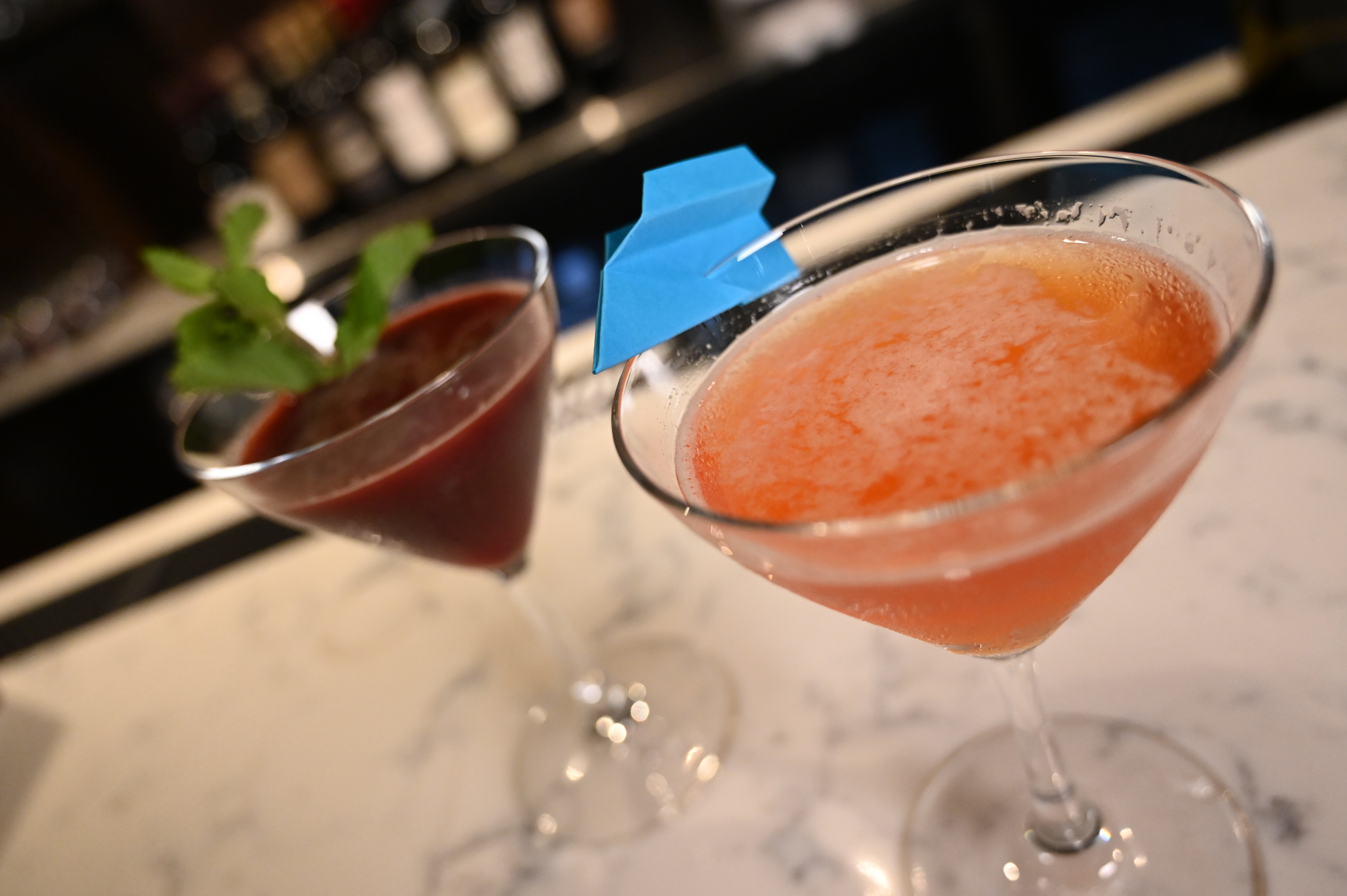 This is a photo of two of Posto Itatian's signature coctails. Red and Orange