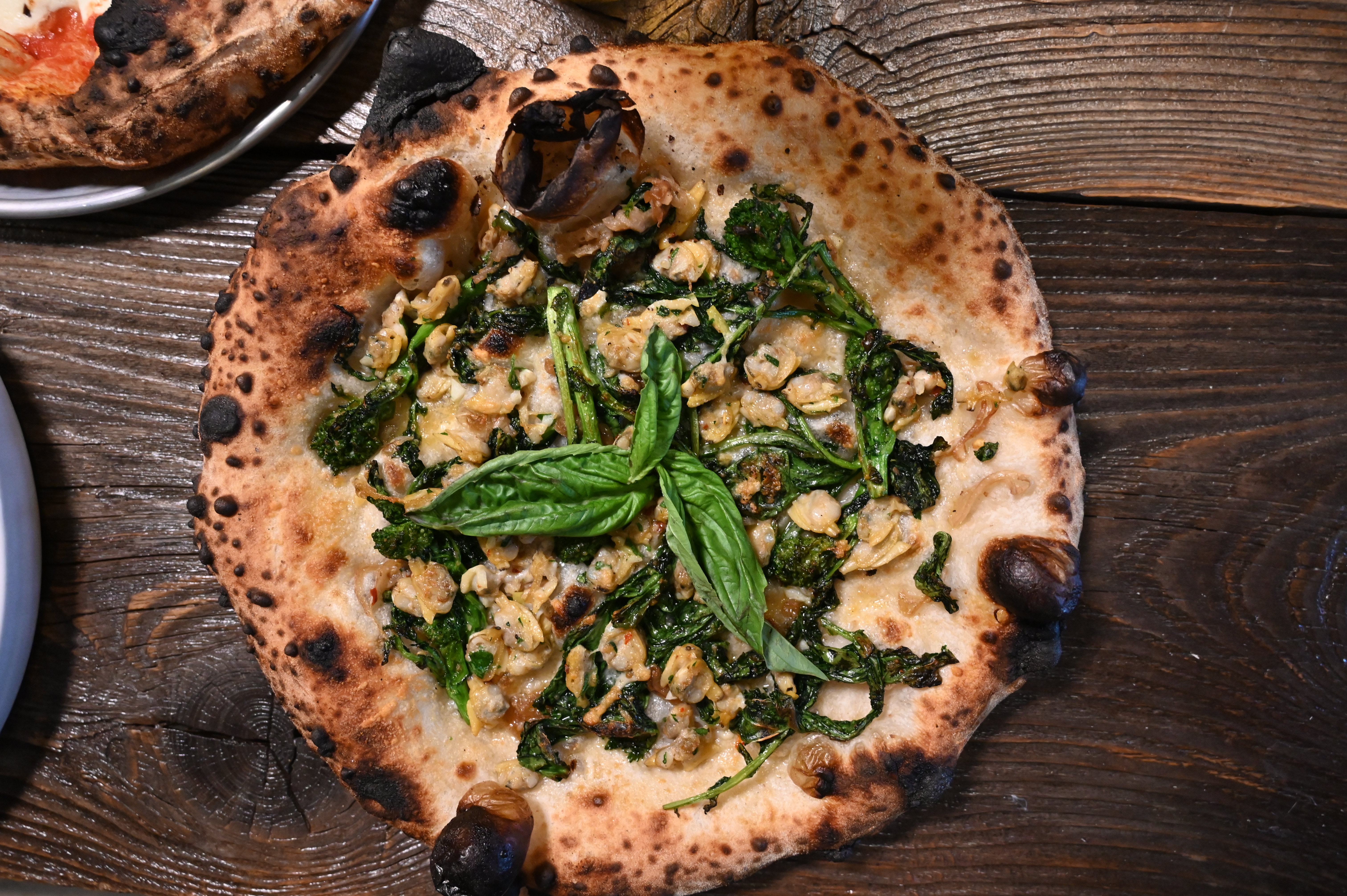 This is a photo of Posto Italian's Asparagus Pizza