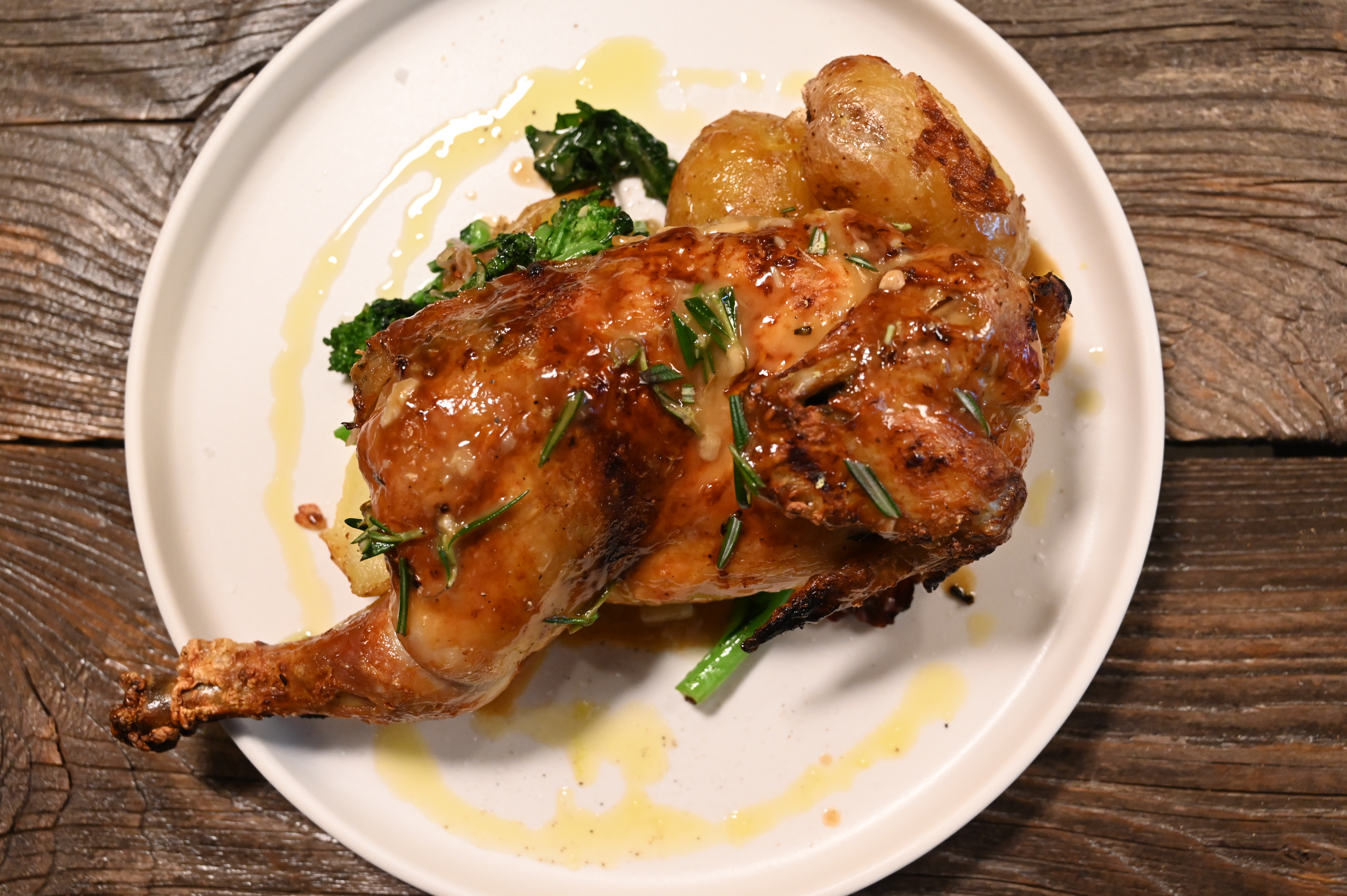 This is a photo of Posto Italian's wood roasted half chicken