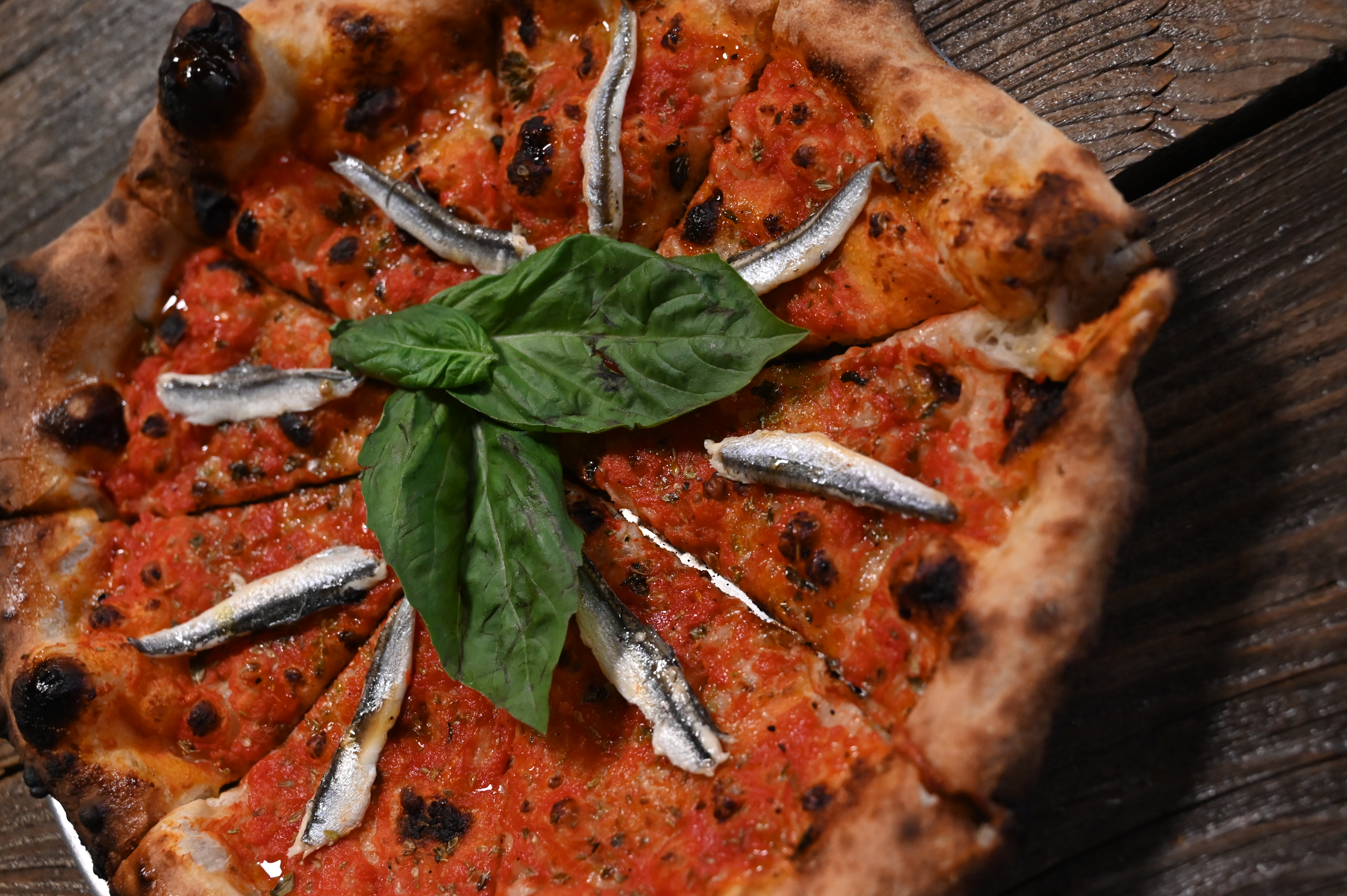 This is a photo of Posto Italian's anchovie pizza