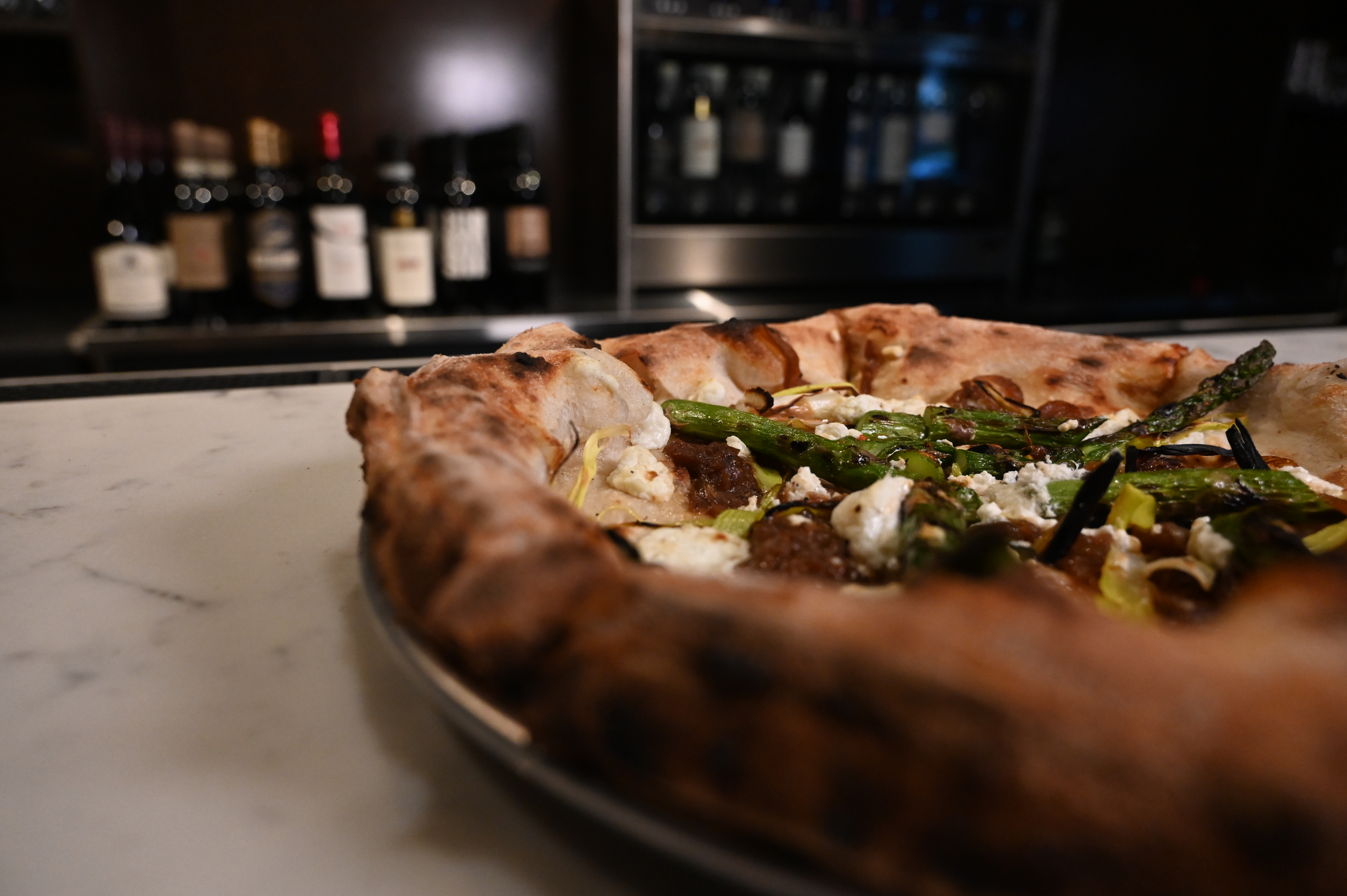 This is a photo of Posto Italian's asparagus pizza